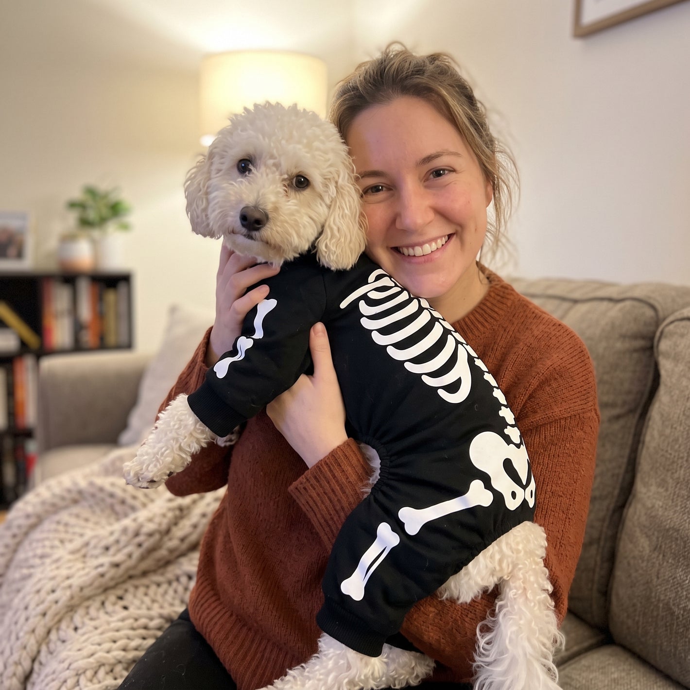 Happy LumiPuppy customer hugging her dog
